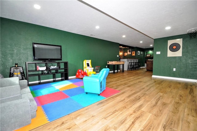 1624 Windsor Rd, North Huntingdon, PA 15642 - game room with wood finished floors, baseboards, recessed lighting, and an accent wall