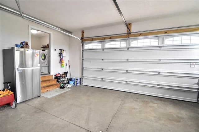 1624 Windsor Rd, North Huntingdon, PA 15642 - garage featuring freestanding refrigerator and washer / clothes dryer