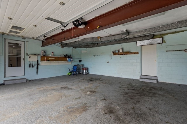 1105 Greentree Rd, Green Tree, PA 15220 - garage with a garage door opener and concrete block wall
