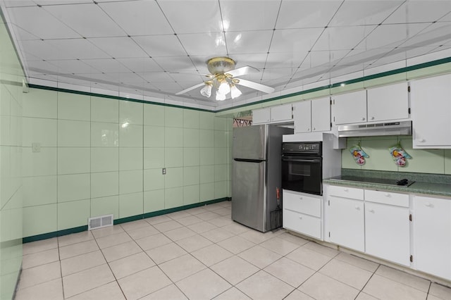 1105 Greentree Rd, Green Tree, PA 15220 - kitchen with black appliances, under cabinet range hood, a ceiling fan, and white cabinetry