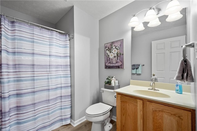 5121 Forest Ridge Dr, South Fayette, PA 15057 - full bath with toilet, vanity, wood finished floors, a textured ceiling, and a chandelier