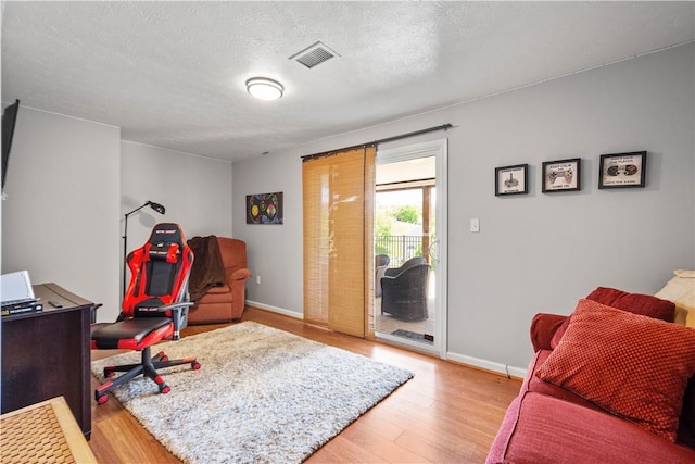 5121 Forest Ridge Dr, South Fayette, PA 15057 - office with wood finished floors, baseboards, and a textured ceiling