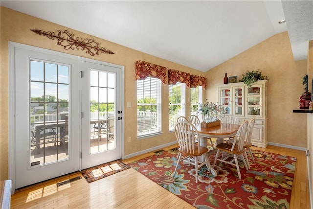 5121 Forest Ridge Dr, South Fayette, PA 15057 - dining room with lofted ceiling, light wood finished floors, and baseboards