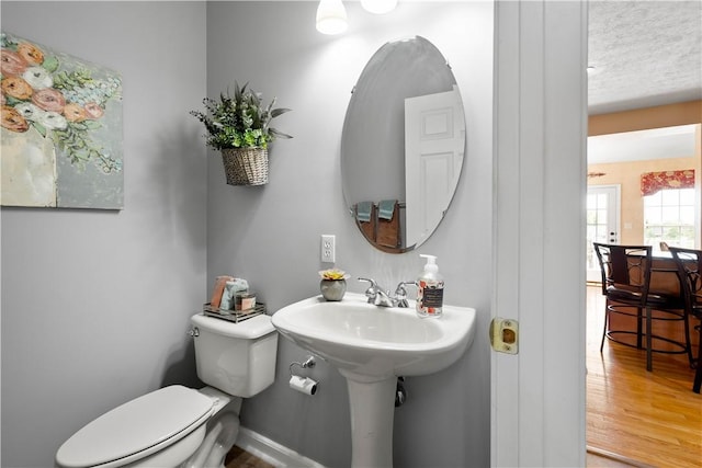 5121 Forest Ridge Dr, South Fayette, PA 15057 - half bathroom with toilet and wood finished floors
