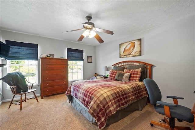 5121 Forest Ridge Dr, South Fayette, PA 15057 - bedroom with multiple windows, light carpet, ceiling fan, baseboards, and a textured ceiling