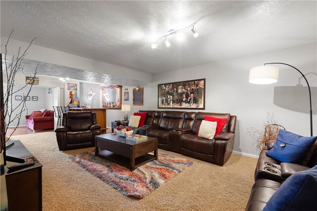 5121 Forest Ridge Dr, South Fayette, PA 15057 - living room featuring carpet, a textured ceiling, and baseboards