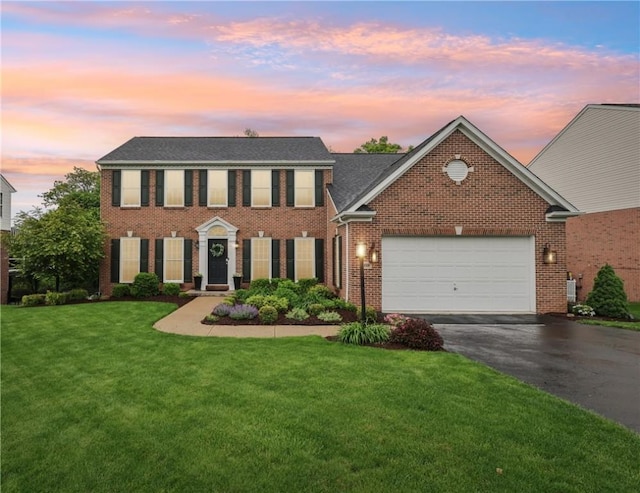 319 Buffalo Ridge Rd, Peters Twp, PA 15317 - colonial inspired home with asphalt driveway, a garage, a yard, brick siding, and roof with shingles