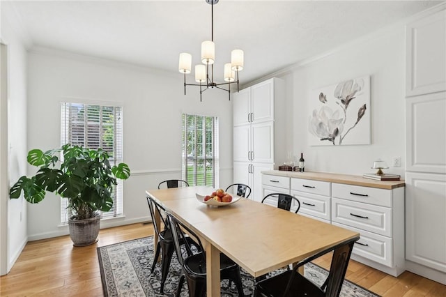 319 Buffalo Ridge Rd, Peters Twp, PA 15317 - dining room with a chandelier, ornamental molding, light wood-type flooring, and baseboards