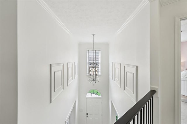 319 Buffalo Ridge Rd, Peters Twp, PA 15317 - corridor with a chandelier, healthy amount of natural light, an upstairs landing, crown molding, and a towering ceiling