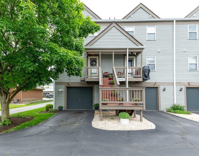 1099 Riverside Dr Unit H, Bridgewater, PA 15009 - view of property featuring asphalt driveway and a garage