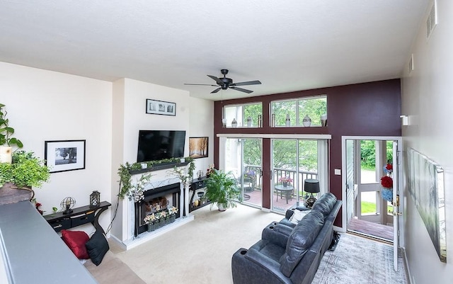 1099 Riverside Dr Unit H, Bridgewater, PA 15009 - living room with a high end fireplace, ceiling fan, and carpet floors