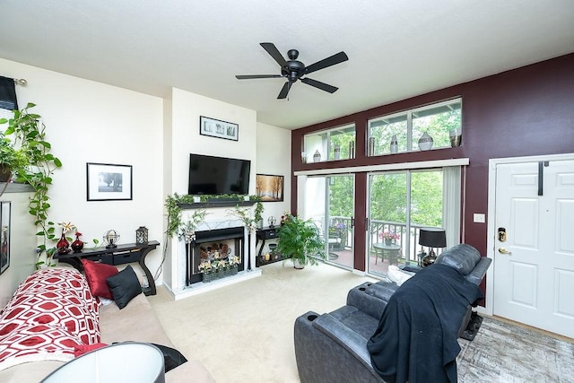 1099 Riverside Dr Unit H, Bridgewater, PA 15009 - living area with a high end fireplace, a ceiling fan, and carpet