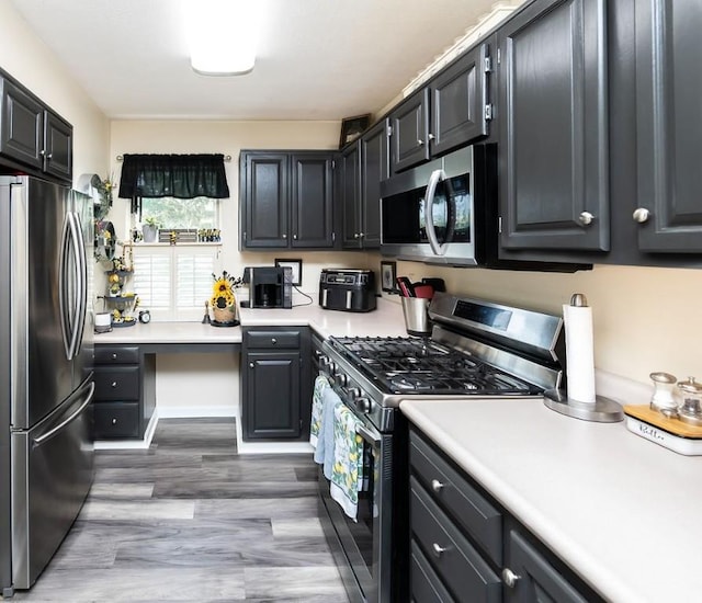 1099 Riverside Dr Unit H, Bridgewater, PA 15009 - kitchen with stainless steel appliances, light wood-type flooring, and light countertops
