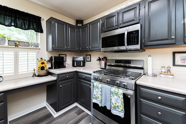 1099 Riverside Dr Unit H, Bridgewater, PA 15009 - kitchen featuring appliances with stainless steel finishes, dark wood-style floors, and light countertops