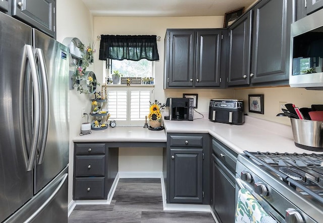 1099 Riverside Dr Unit H, Bridgewater, PA 15009 - kitchen featuring appliances with stainless steel finishes, dark wood finished floors, and light countertops