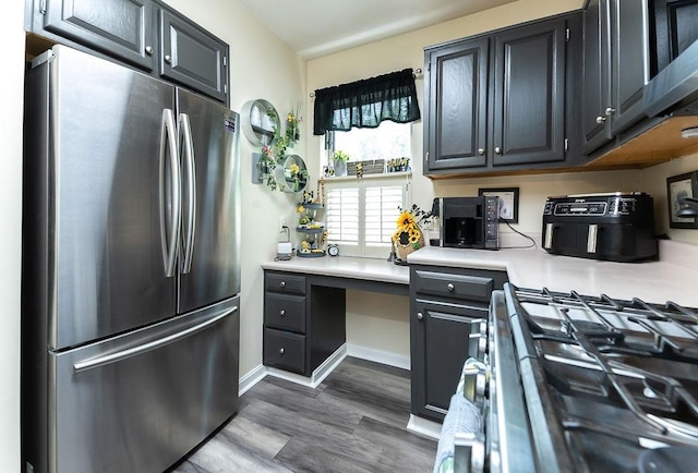 1099 Riverside Dr Unit H, Bridgewater, PA 15009 - kitchen with stainless steel appliances, light countertops, dark wood-type flooring, and baseboards