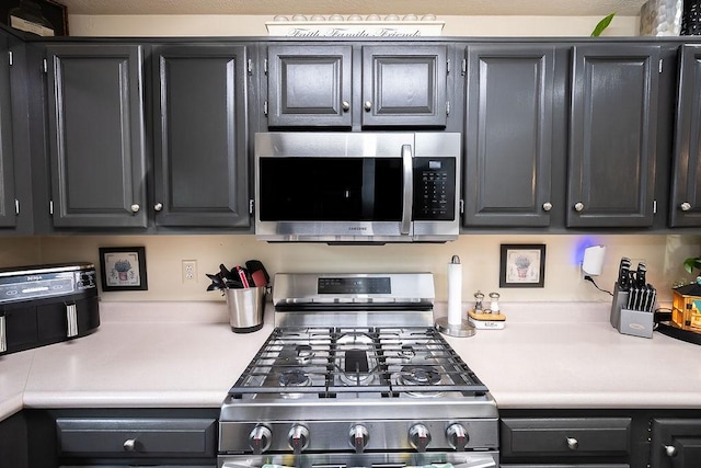 1099 Riverside Dr Unit H, Bridgewater, PA 15009 - kitchen featuring stainless steel appliances and light countertops