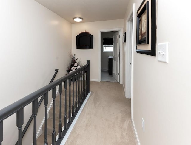 1099 Riverside Dr Unit H, Bridgewater, PA 15009 - hallway with light carpet, an upstairs landing, and baseboards