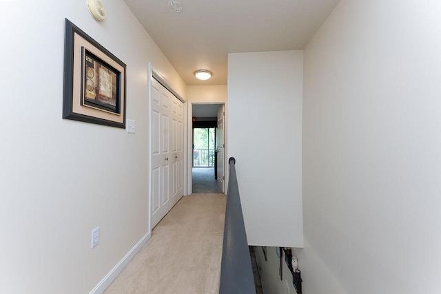 1099 Riverside Dr Unit H, Bridgewater, PA 15009 - hall with light colored carpet, baseboards, and an upstairs landing