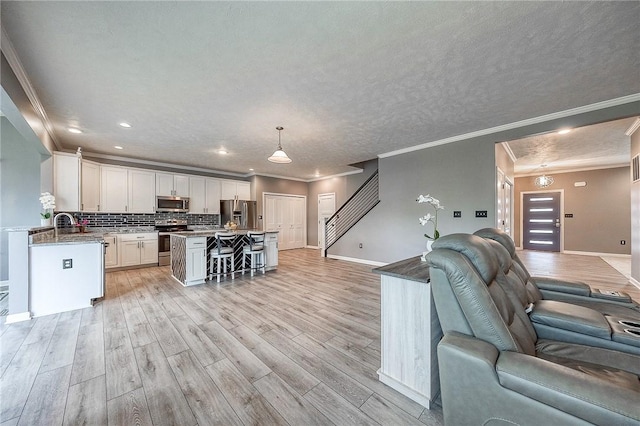 8 Pony Ct, Findlay Twp, PA 15126 - living area with baseboards, crown molding, light wood-style floors, and recessed lighting