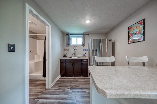 8 Pony Ct, Findlay Twp, PA 15126 - kitchen with stainless steel fridge, dark wood-type flooring, a textured ceiling, dark brown cabinets, and a sink