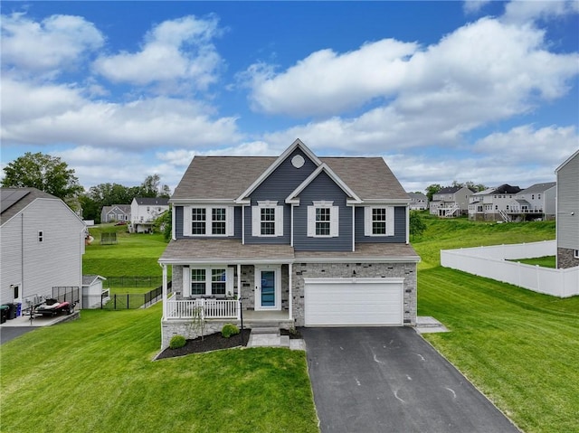 8 Pony Ct, Findlay Twp, PA 15126 - traditional home with covered porch, a garage, driveway, a residential view, and stone siding