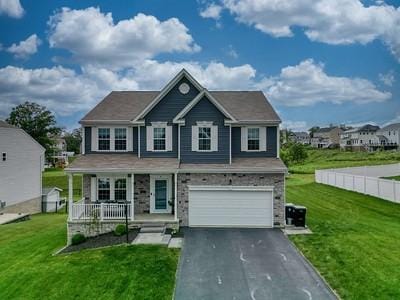 8 Pony Ct, Findlay Twp, PA 15126 - view of front of house featuring covered porch, an attached garage, asphalt driveway, and a front yard