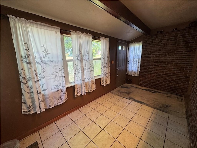 937 Freeport Rd, Natrona Hts/Harrison Twp, PA 15065 - foyer entrance featuring light tile patterned floors and brick wall