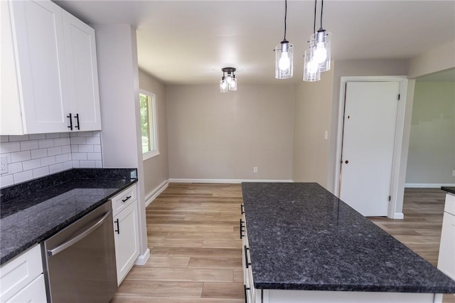 5 Albert St, South Union Twp, PA 15401 - kitchen with stainless steel dishwasher, light wood-style flooring, backsplash, white cabinets, and a kitchen island
