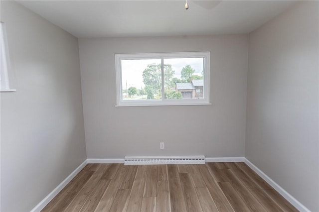 5 Albert St, South Union Twp, PA 15401 - spare room with a baseboard heating unit and wood finished floors