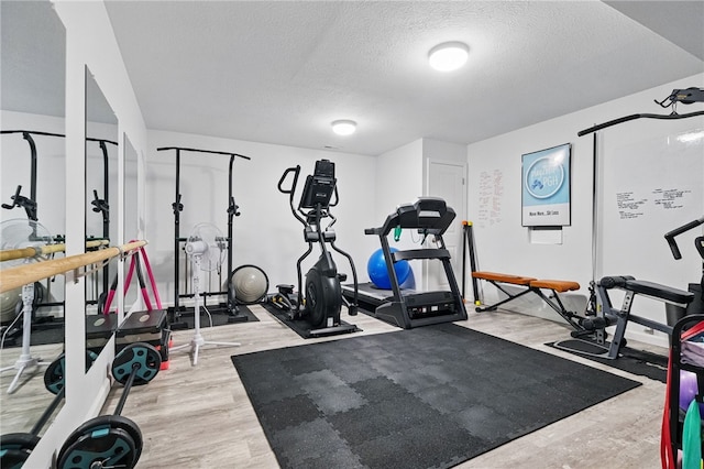 1340 Diamond Ct, Upper St Clair, PA 15241 - exercise area with a textured ceiling and wood finished floors