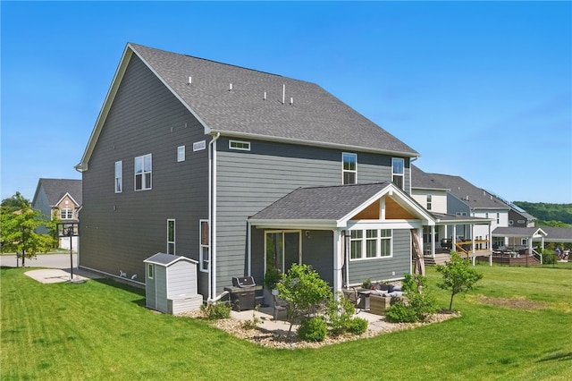 1340 Diamond Ct, Upper St Clair, PA 15241 - back of property with an outdoor hangout area, a patio area, a lawn, and roof with shingles