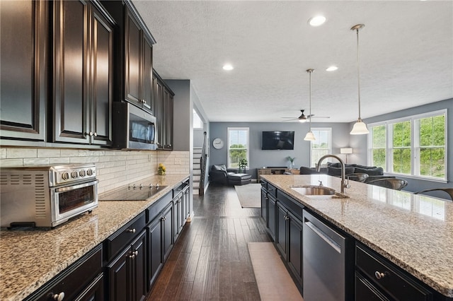 1340 Diamond Ct, Upper St Clair, PA 15241 - kitchen with a sink, appliances with stainless steel finishes, open floor plan, plenty of natural light, and recessed lighting