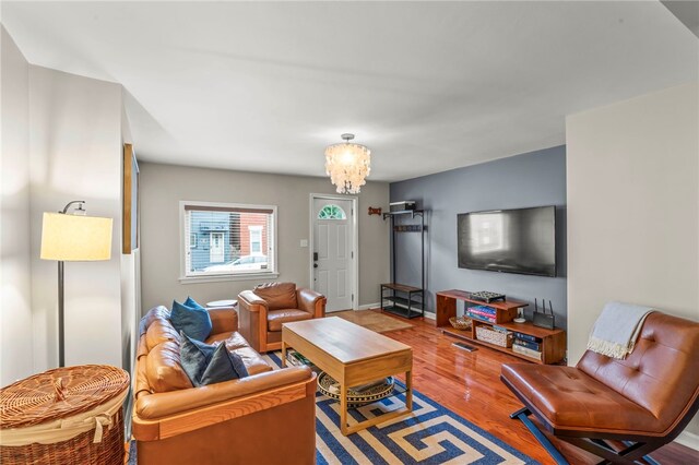 1816 Jane, South Side, PA 15203 - living area with wood finished floors, a chandelier, and baseboards