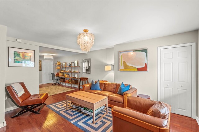 1816 Jane, South Side, PA 15203 - living area featuring wood finished floors, a chandelier, a wall mounted AC, and baseboards