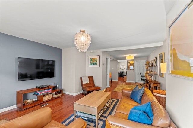 1816 Jane, South Side, PA 15203 - living room featuring wood finished floors, baseboards, and a chandelier