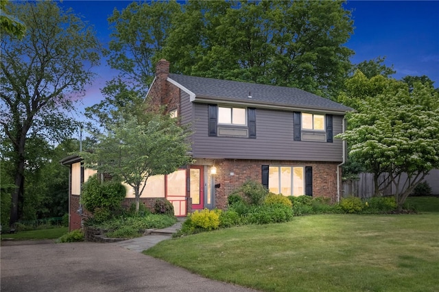306 Tadmar Ave, Ross Twp, PA 15237 - colonial house with a chimney, a lawn, and brick siding