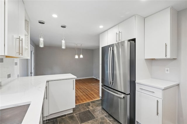306 Tadmar Ave, Ross Twp, PA 15237 - kitchen with freestanding refrigerator, white cabinets, recessed lighting, hanging light fixtures, and baseboards