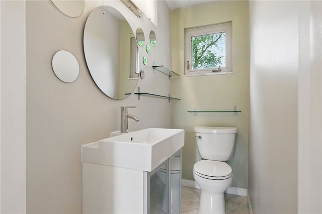 306 Tadmar Ave, Ross Twp, PA 15237 - bathroom featuring toilet, vanity, and baseboards