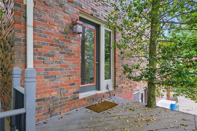 306 Tadmar Ave, Ross Twp, PA 15237 - doorway to property with brick siding and a wooden deck