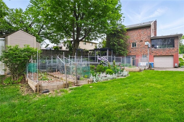 306 Tadmar Ave, Ross Twp, PA 15237 - view of yard with a vegetable garden and an attached garage