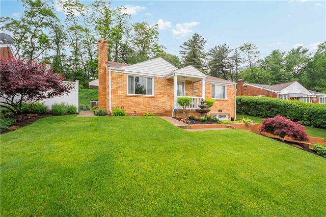 1137 Michael Dr, Baldwin Boro, PA 15227 - view of front of home with a chimney, brick siding, and a front yard