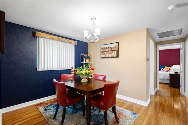 1137 Michael Dr, Baldwin Boro, PA 15227 - dining room featuring a chandelier, wood finished floors, and baseboards