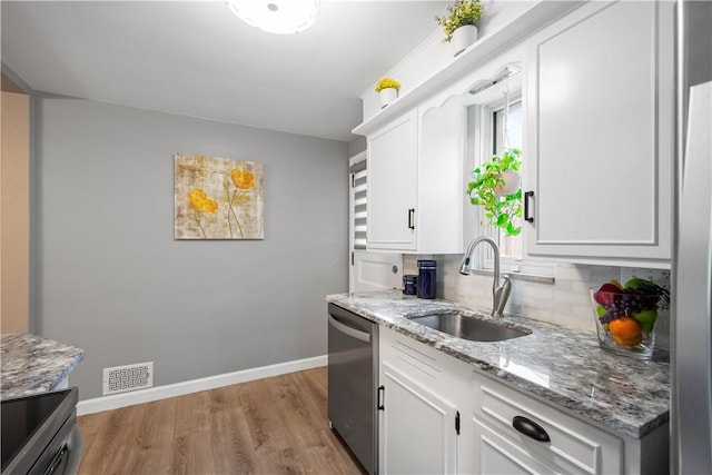1137 Michael Dr, Baldwin Boro, PA 15227 - kitchen with a sink, dishwasher, baseboards, and light wood-style flooring