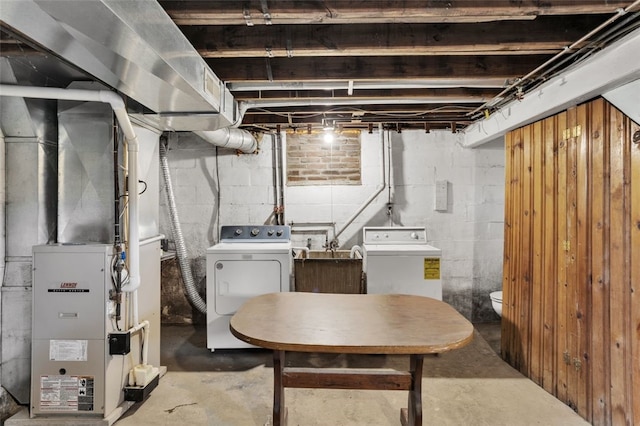 5352 Highgrove Rd, Whitehall, PA 15236 - unfinished basement featuring washing machine and clothes dryer and heating unit
