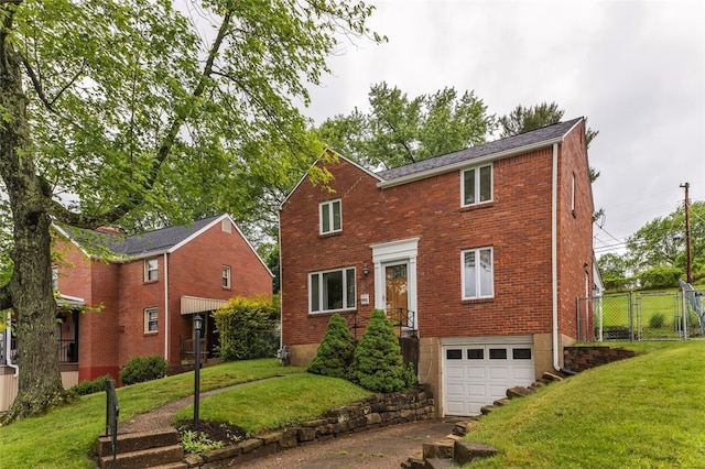 5352 Highgrove Rd, Whitehall, PA 15236 - view of front facade featuring an attached garage, concrete driveway, brick siding, and a gate