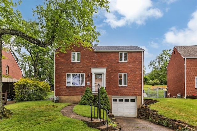 5352 Highgrove Rd, Whitehall, PA 15236 - view of front of home featuring a garage, asphalt driveway, brick siding, and a shingled roof
