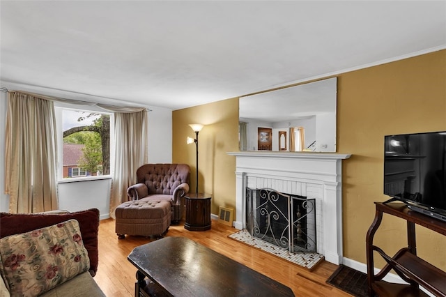 5352 Highgrove Rd, Whitehall, PA 15236 - living room with light wood-style flooring, a fireplace, and baseboards