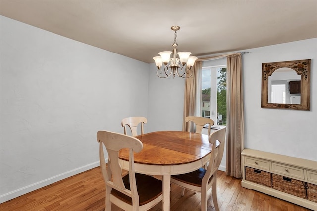 5352 Highgrove Rd, Whitehall, PA 15236 - dining space featuring a chandelier, light wood-type flooring, and baseboards