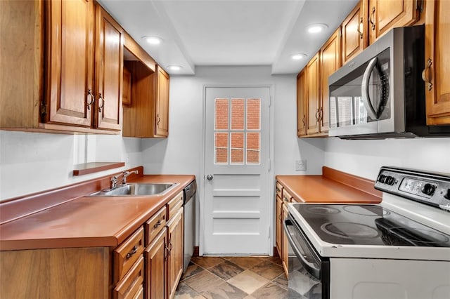 5352 Highgrove Rd, Whitehall, PA 15236 - kitchen with electric stove, stainless steel microwave, a sink, recessed lighting, and brown cabinets
